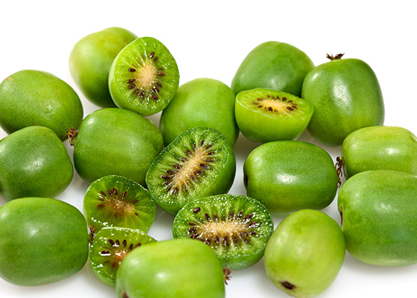 Loose kiwi 'Issai' fruit against a white background