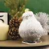 Silver Waxed Amaryllis on a decorated table with pinecones and candle